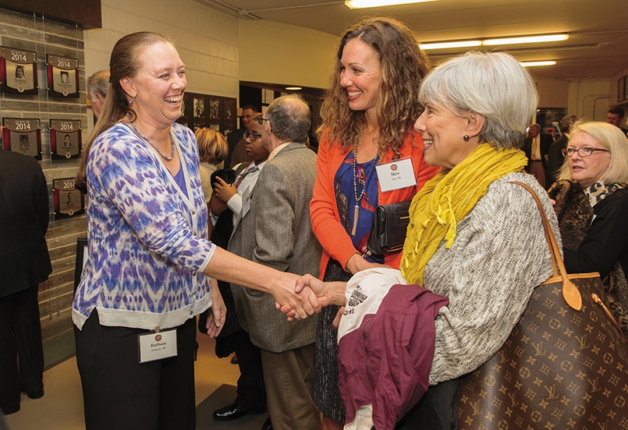 At the Hall of Fame celebration, three-sport athlete Barbara Anne Schaefer ’90 (left) congratulates proud mom Kay Oser Liles as Kay’s daughter, All-American swimmer Skye Fulkerson Tarr ’96 (center), looks on. 